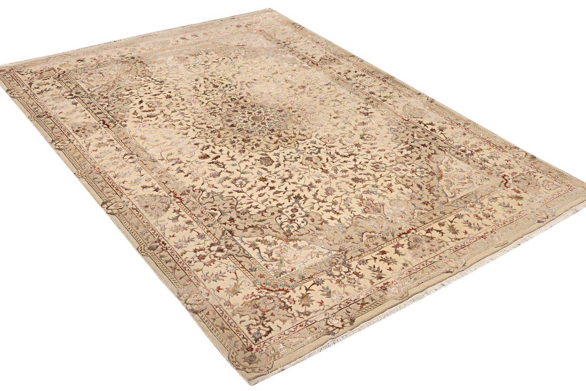 A Tabriz carpet, part silk, c. 311 x 199 cm.