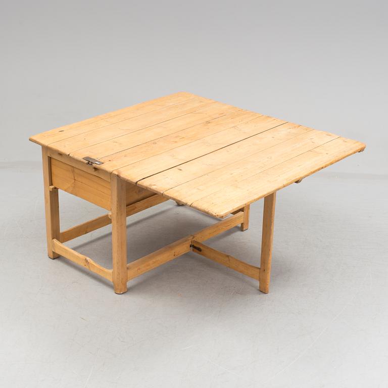 A 19th century pine flap table.