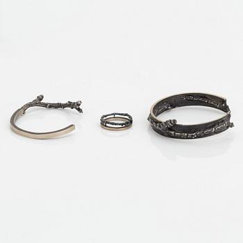 Two Copula silver bracelets and a ring.