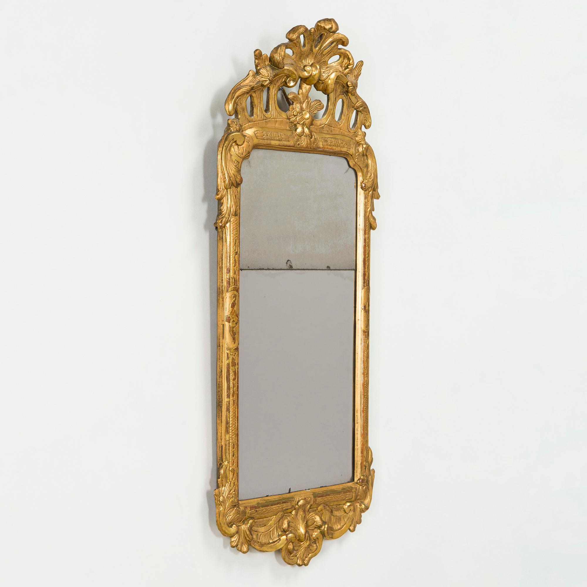 A Rococo giltwood mirror by Nils Meunier (master in Stockholm 1754-97, royal court mirror maker 1769).