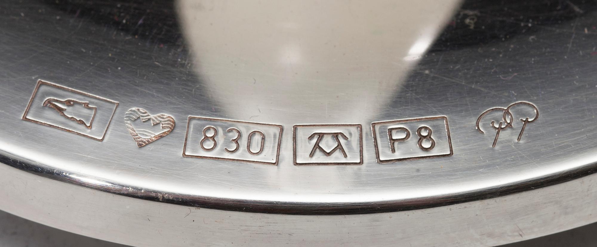 LJUSSTAKE, silver, "Suomi Finland 75 år" Pekka Piekäinen, Auran Kultaseppä, Åbo 1992. Vikt 114,4 g.