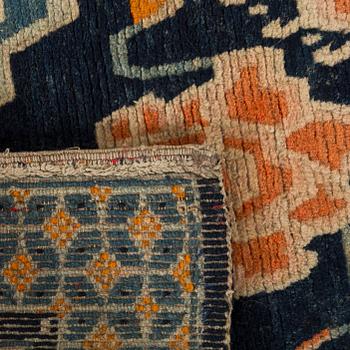 A semaintique Chinese carpet ca 73 x 54 cm.