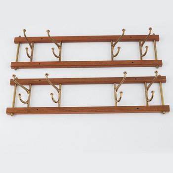 A pair of 'Dekorativ' coat hangers, Skoglunds metallgjuteri, Anderstorp, mid 20th Century.