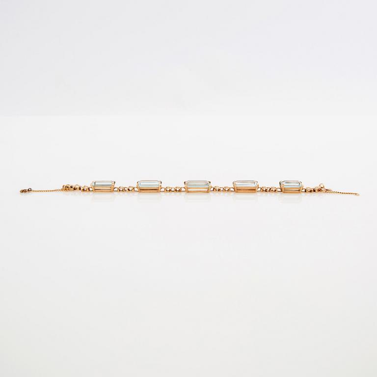 Bracelet 18K gold with step-cut aquamarines.