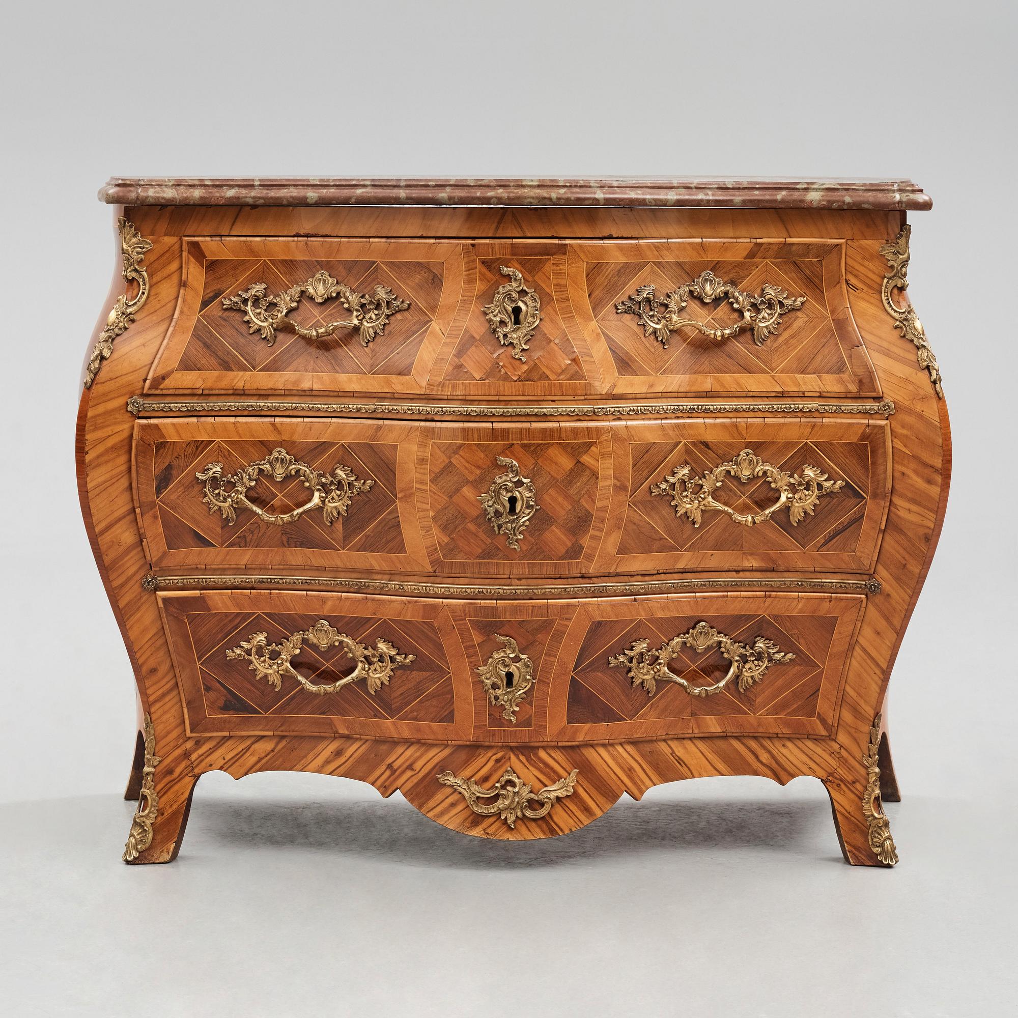 A rosewood-veneered and ormolu-mounted Rococo chest of drawers by J. Wahlbeck (master 1760-1782).