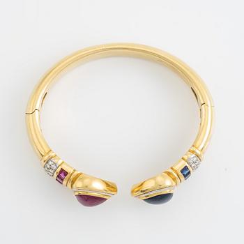 Heart shaped ruby and sapphire and brilliant cut diamond bangle.