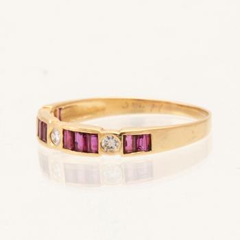 Ring in 18K gold with baguette-cut rubies and round brilliant-cut diamonds.