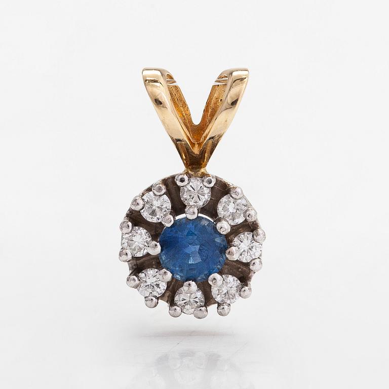 A 14K gold pendant with sapphire and diamonds approx. 0.20 ct in total.