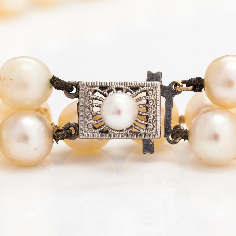 A 2-strand pearl collier with cultured pearls and a 14K white gold clasp.