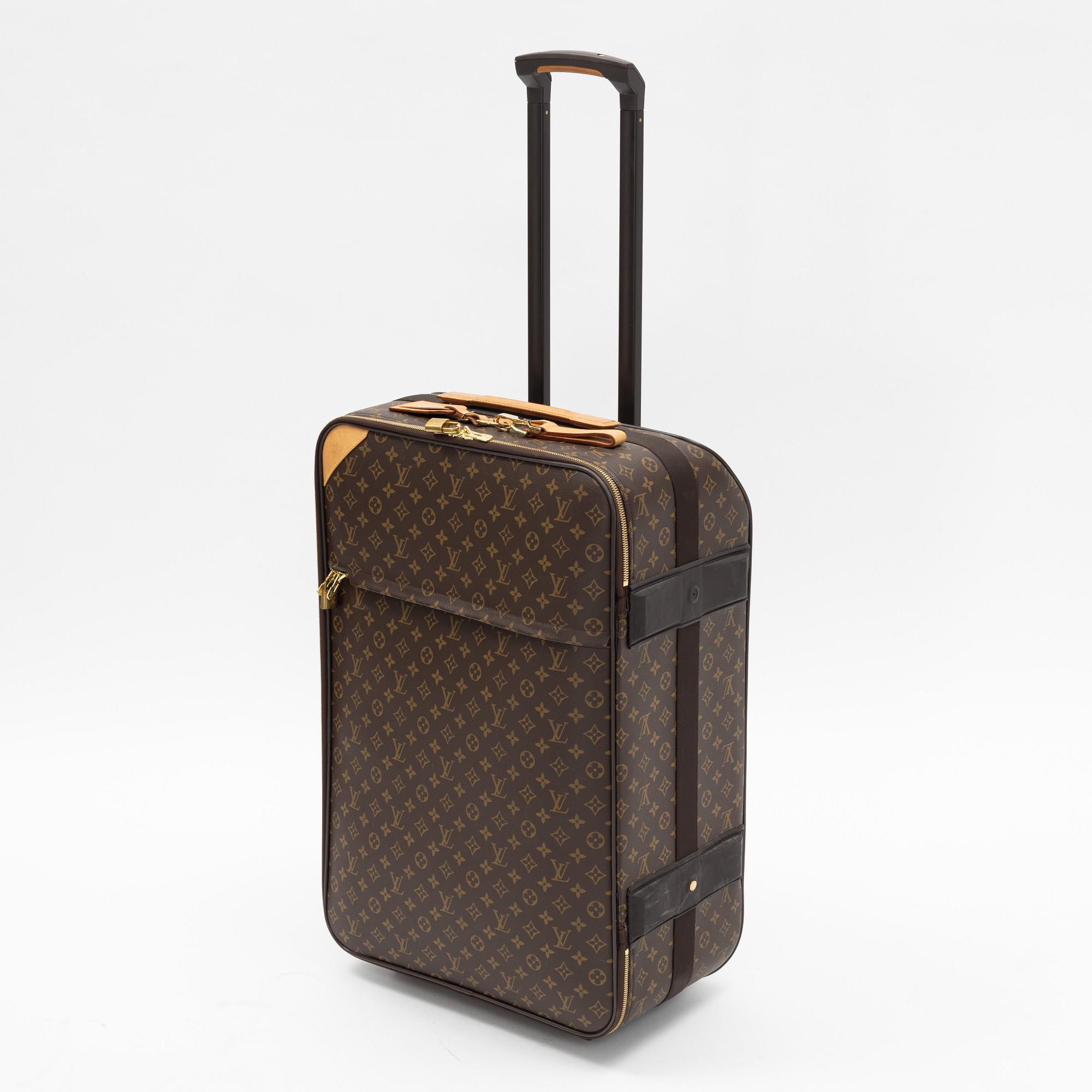 Louis Vuitton, a monogram canvas 'Pégase 65' suitcase.