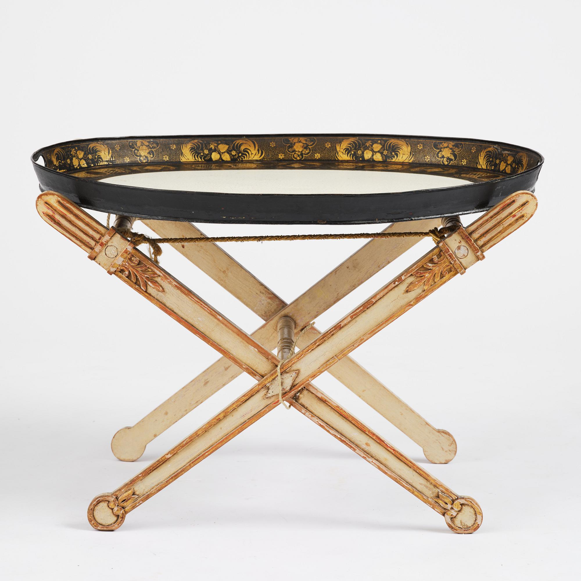 A tole-peinte Empire tray, first part 19th century on a later stand.