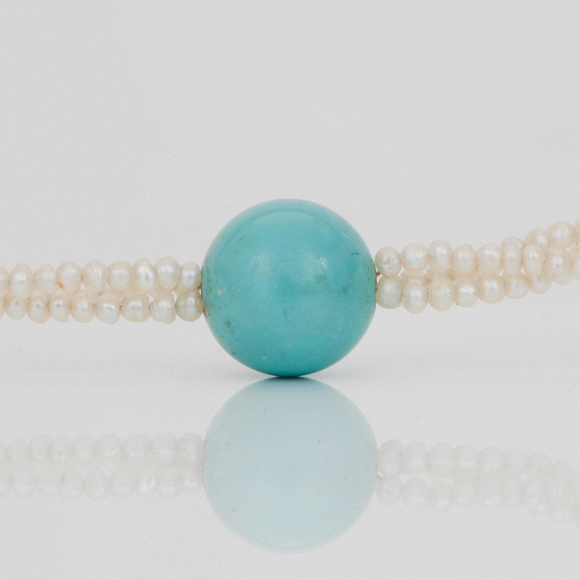 A seed pearl and turquoise bead necklace.