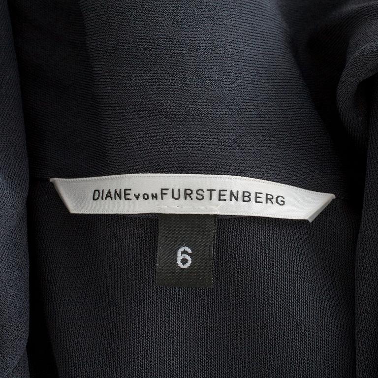 DIANE VON FURSTENBERG, a grey dress with ruffels.