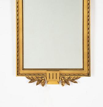 A Gustavian style mirror, mid 20th century.