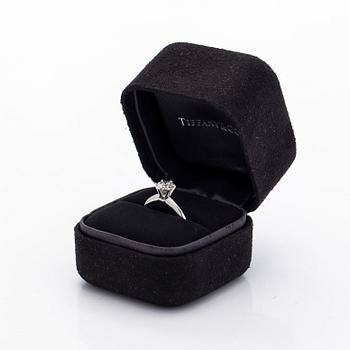 Tiffany & Co, a platinu solitaire ring with a brilliant-cut diamond.