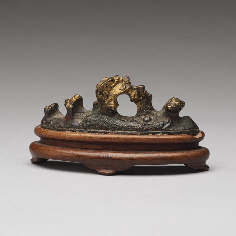 A bronze brush rest, Ming dynasty (1368-1644).
