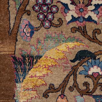 An antique/semi-antique Kerman carpet c 415 x 305 cm.