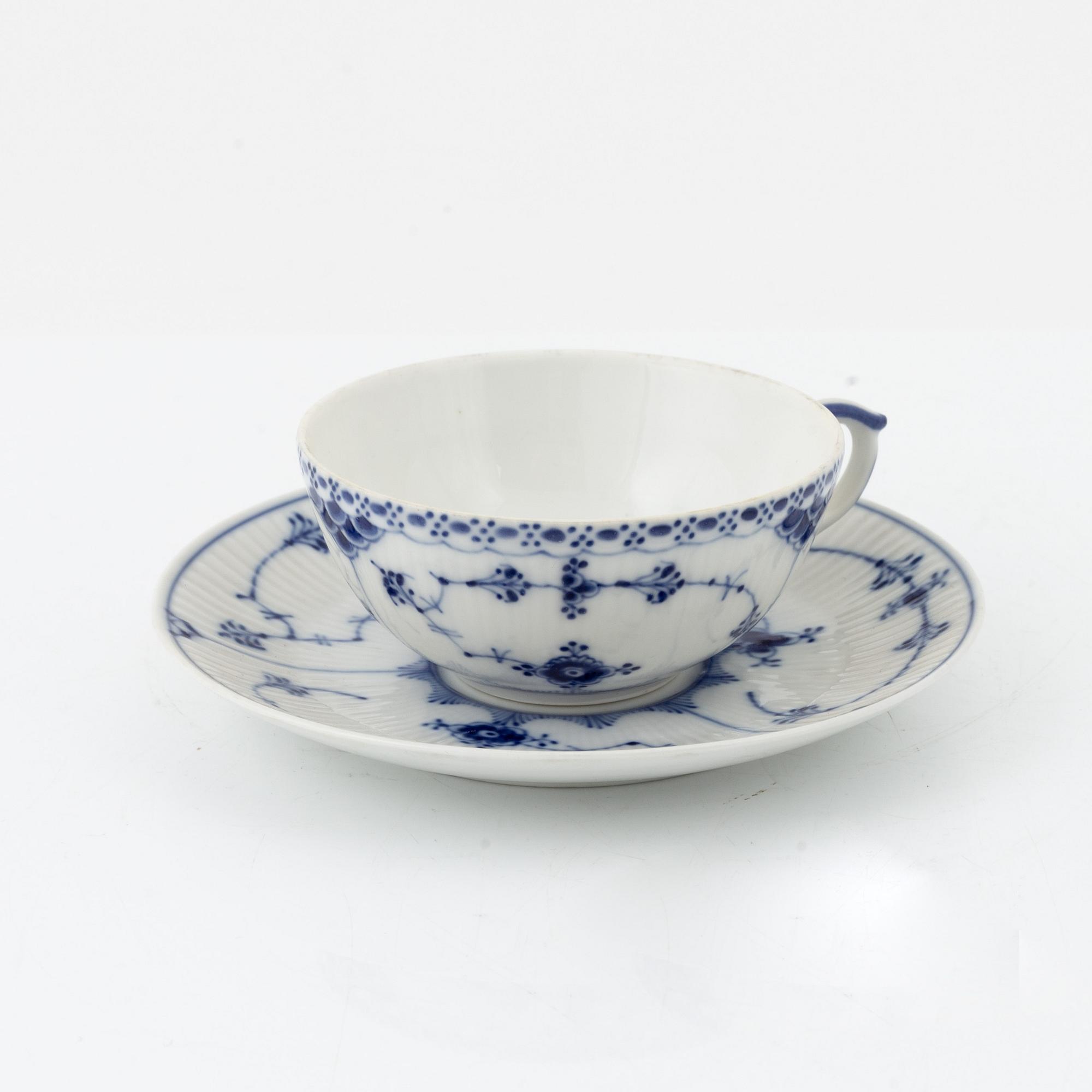 A 24-piece 'Musselmalet' tea service, Rifflet and half lace, Royal Copenhagen, Denmark.