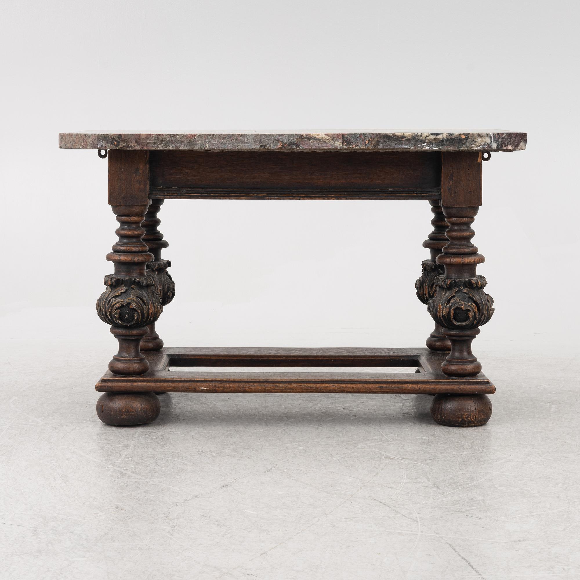 A 19th century Baroque style stone-top table.