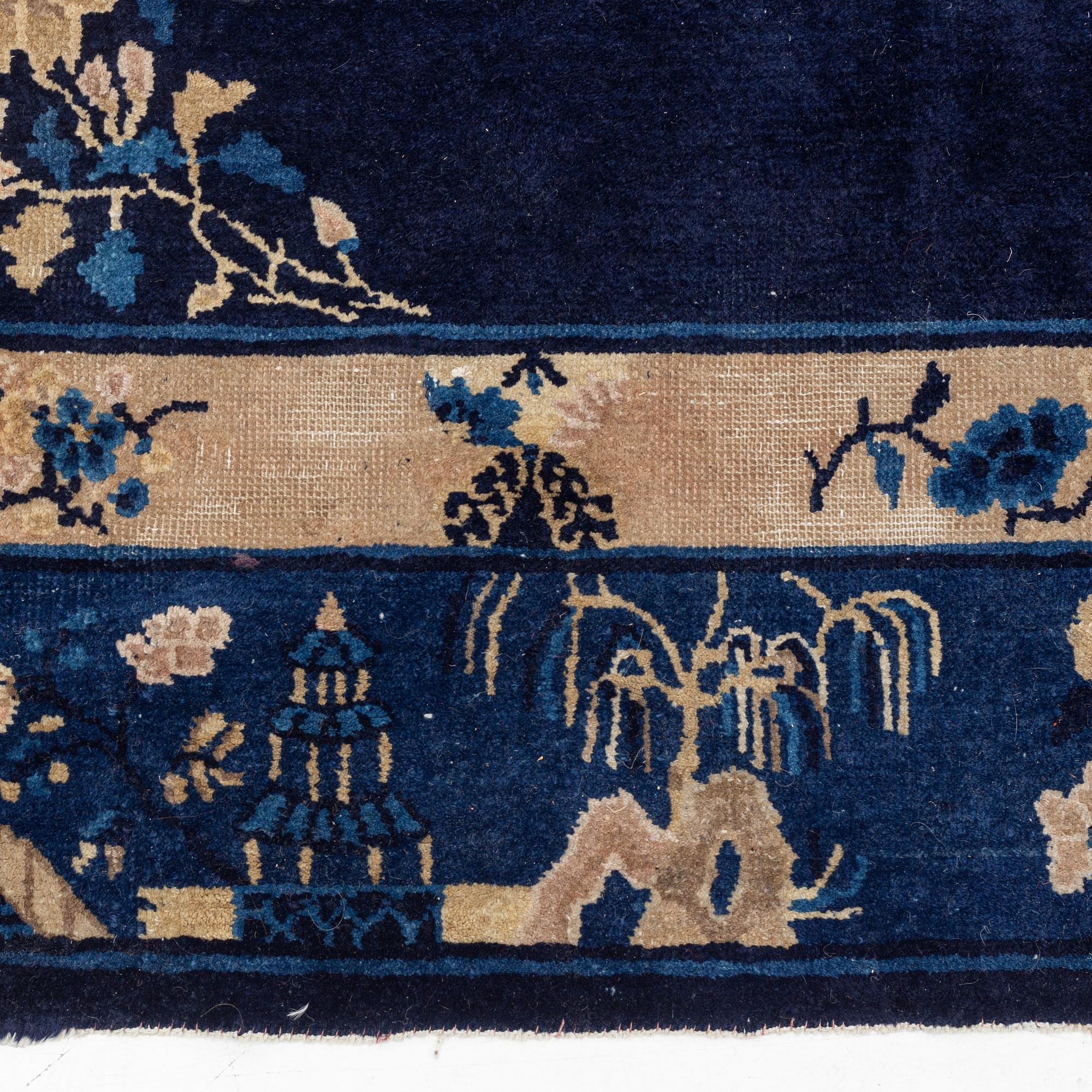 An antique Beijing carpet, northern China, approx. 287 x 239 cm.
