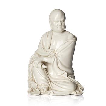 1091. A blanc de Chine seated figure of Bodhidharma, Qing dynasty.