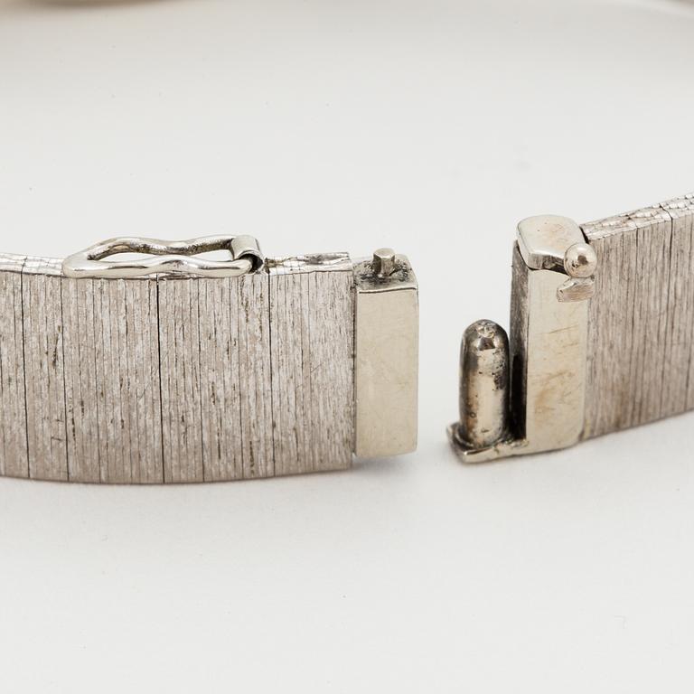 A Movado 18K white gold ladies watch.