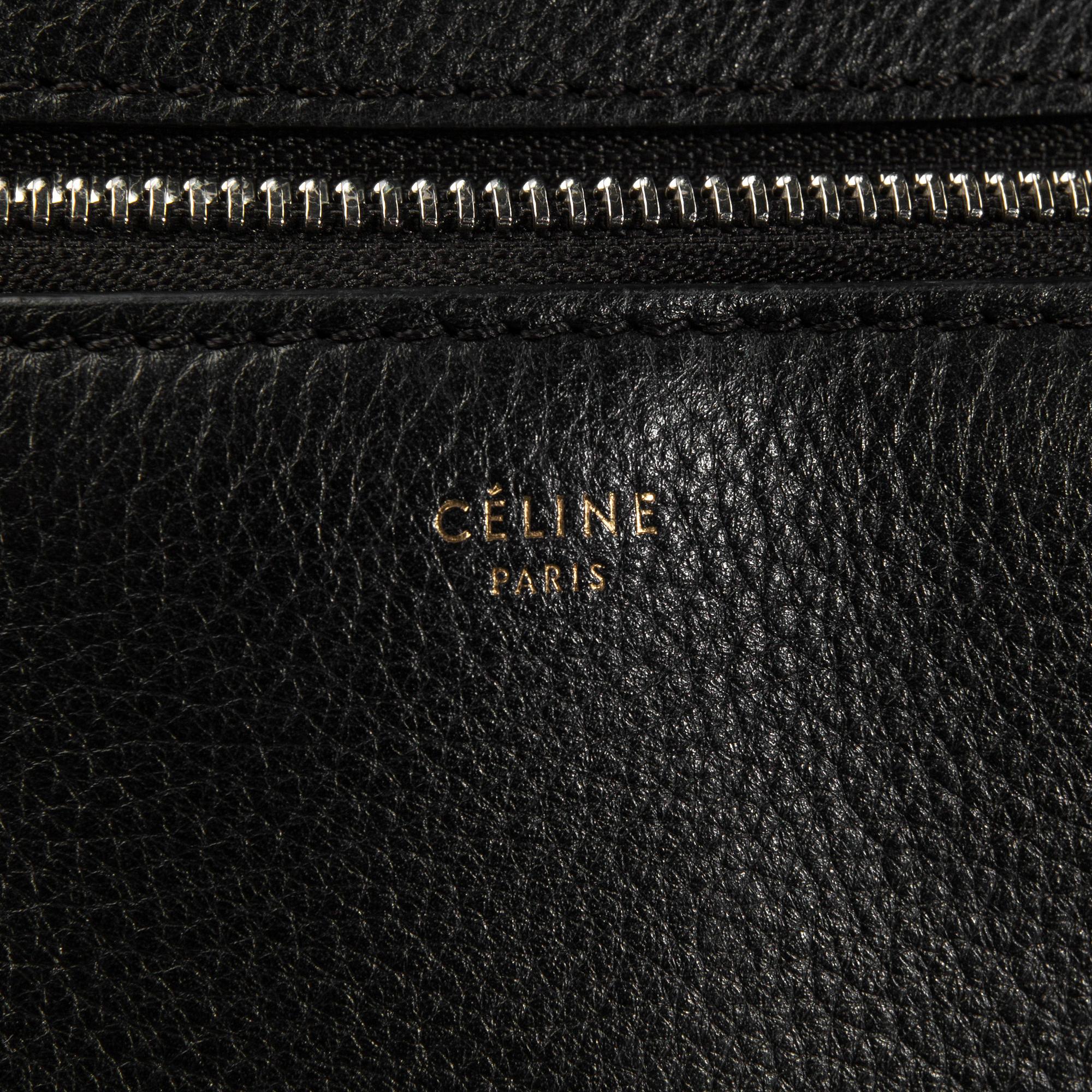 HANDBAG, "Large Edge Bag", Céline, 2013. Black leather with silver-tone hardware, pocket at back with snap closure.