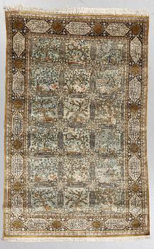 A rug, Old silk Qum, figural,  ca 214 x 142 cm.