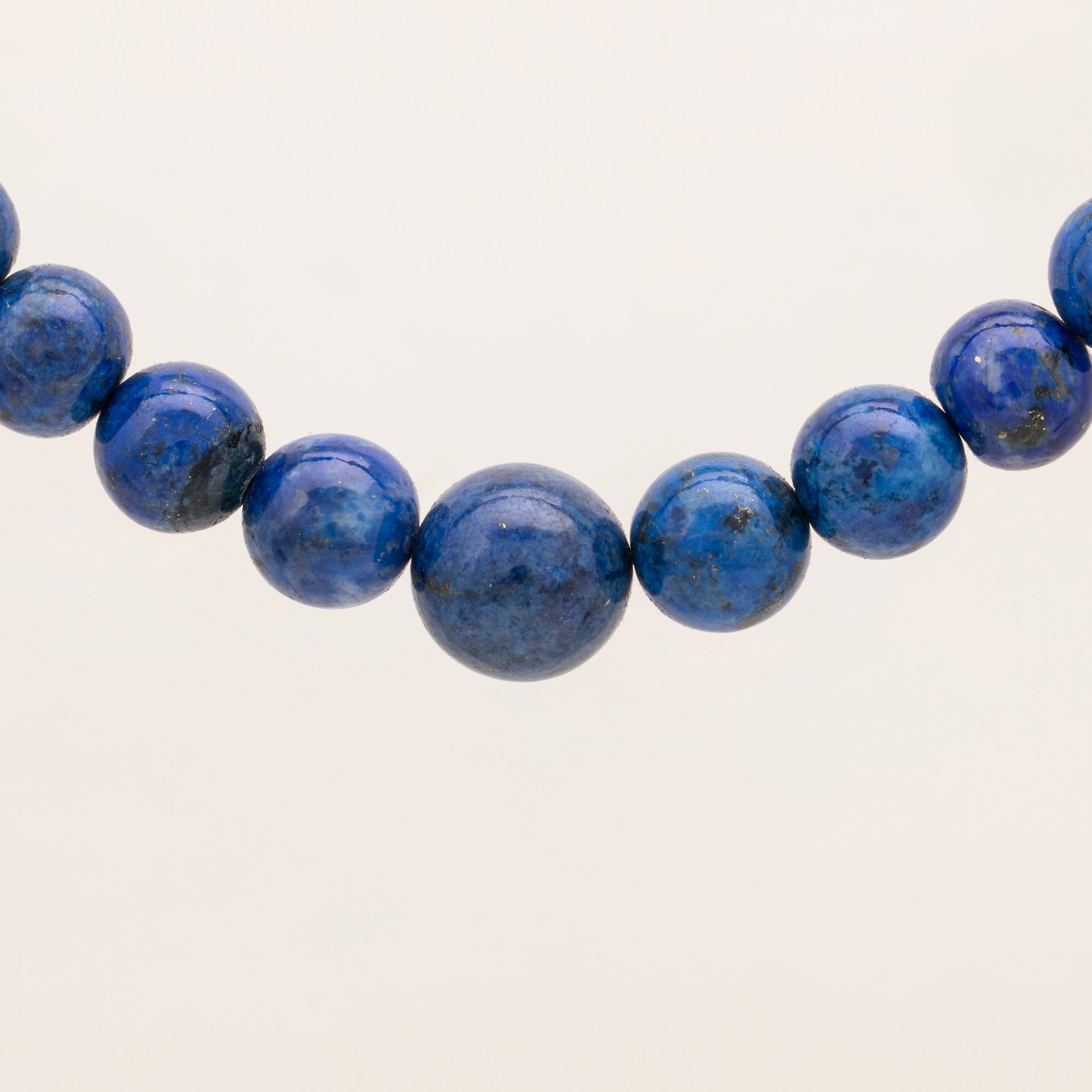 A set of lapis lazuli earrings and necklace.