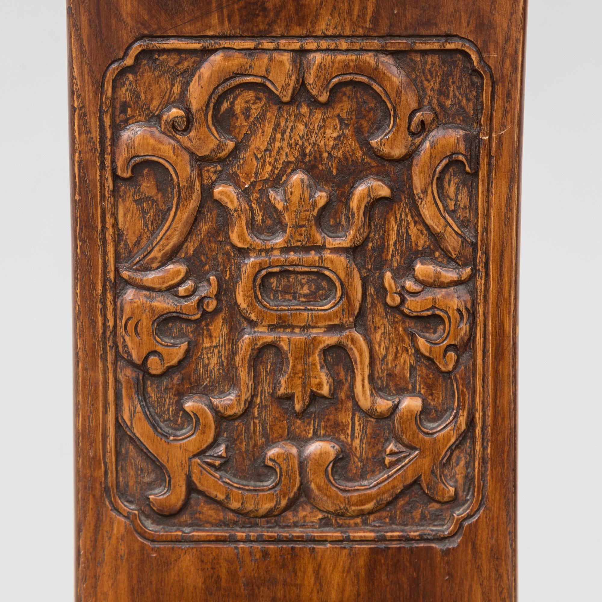 A Chinese wooden armchair, 20th century.