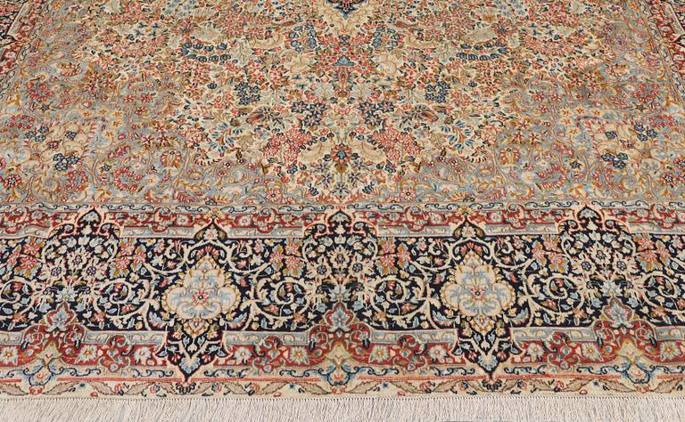 A 'Millefleur' Kerman Laver carpet, c. 398 x 300 cm.