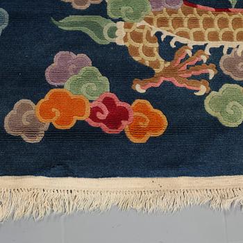 A rug from China, old, 208 x 122 cm.