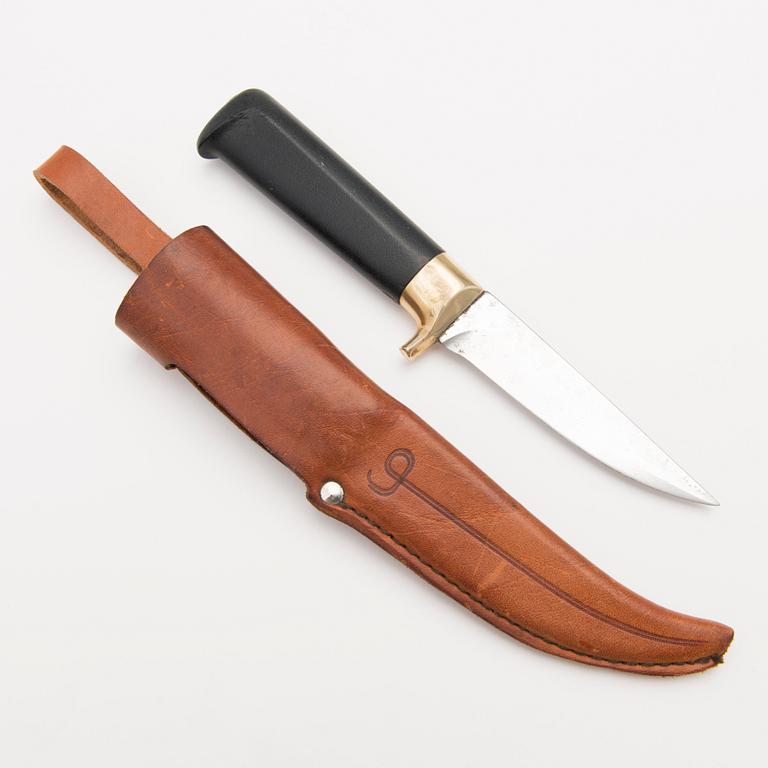 A 1970s Finnish puukko knife in stainless steel, nylon and brass designed by Tapio Wirkkala, Lapin Puukko.