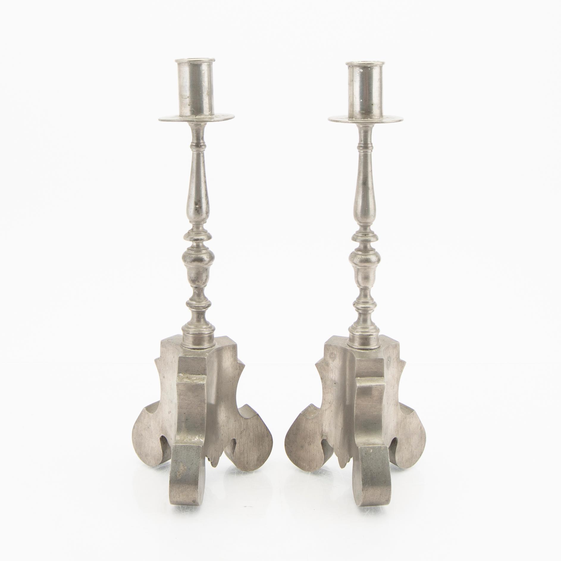 Firma Svenskt Tenn,  a pair of 1928 pewter candle sticks.