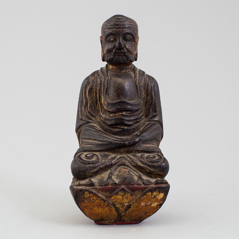 A wooden Japanese sculpture of a deity, 19th Century.