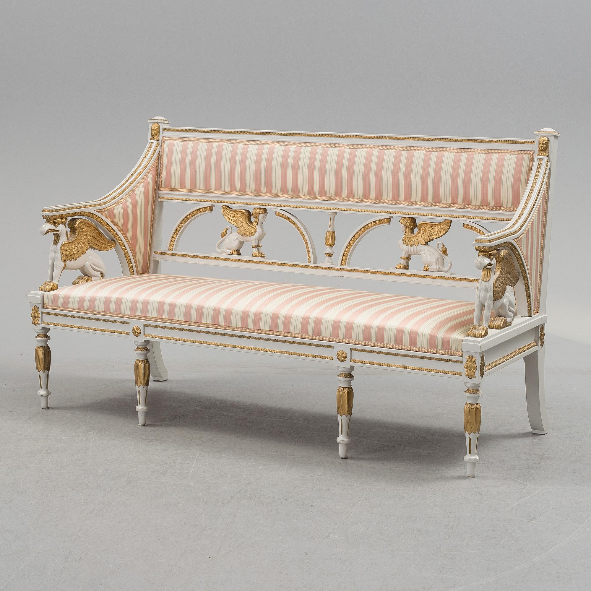 A set of two armchairs, a sofa, a stool and a chair. Early 20th century.