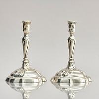A pair of German silver Rococo candlesticks, marks of Johann Hans Jakob Baur, Augsburg 1777-1779.