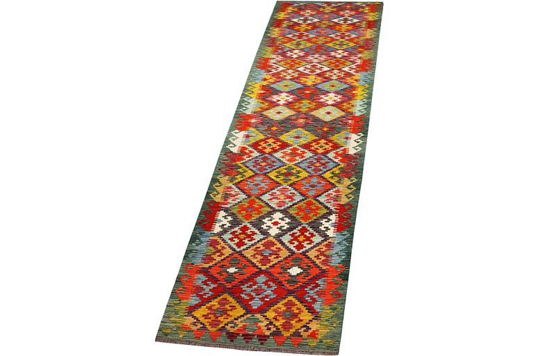A runner carpet, Kilim, c. 507 x 85 cm.