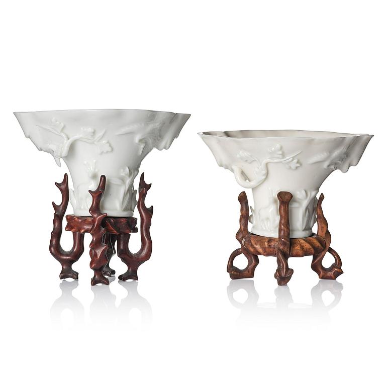 A pair of blanc de chine rhinoceros libation cups, Qing dynasty, Kangxi (1662-1722).