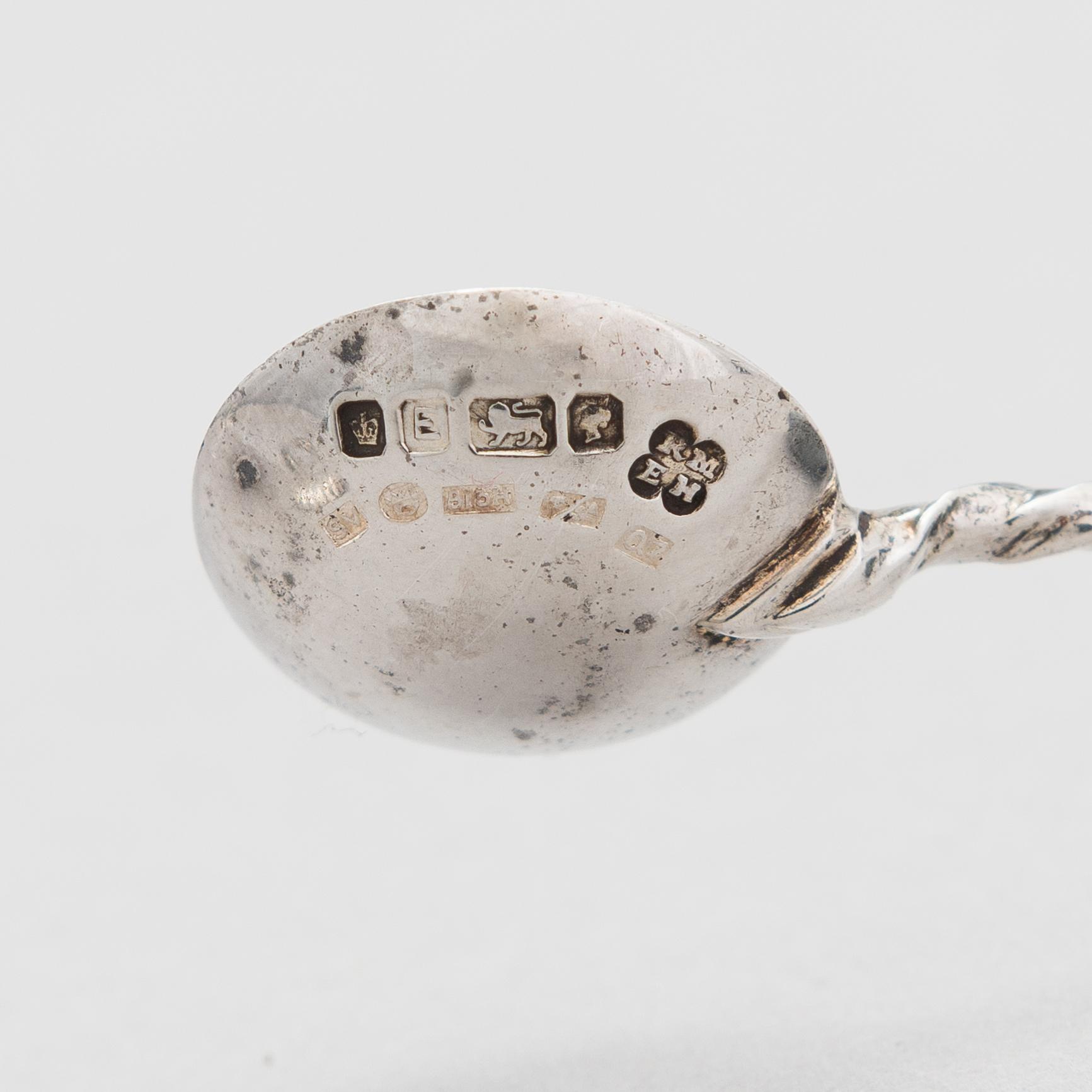 A pair of silver saltcellars, maker's mark of John Edward Wilmot, Birmingham year 1900, and two silver salt spoons.