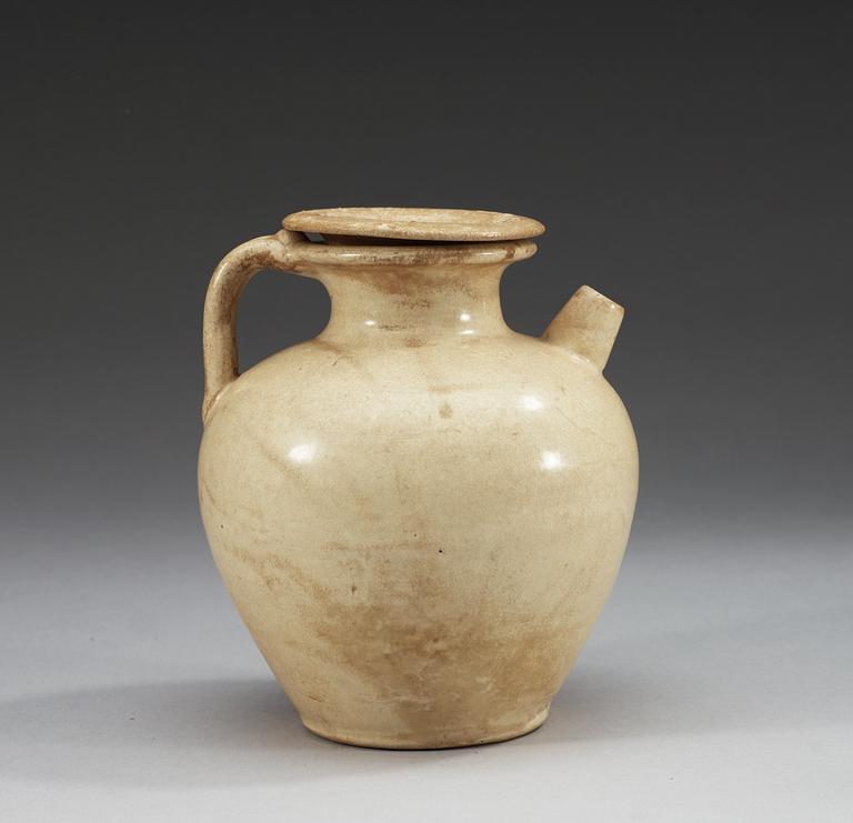 A cream glazed ewer with cover, Tang dynasty (618-907).