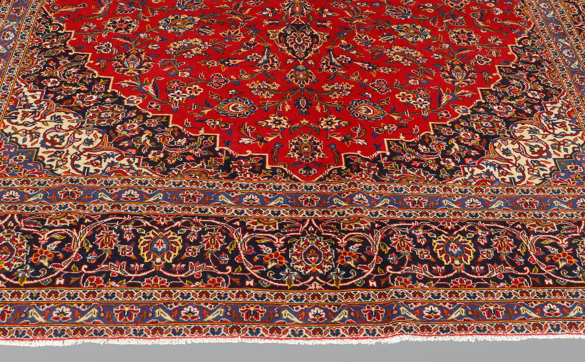 A carpet, Kashan signed, ca 385 x 293 cm.