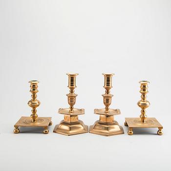 A set of two Baroque-style brass candles ticks.