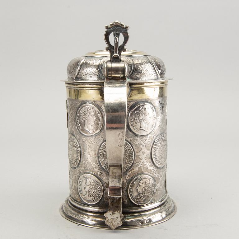 A German 18th century parcel-gilt silver coin-tankard, mark of Johann Friedrich Beyer, Schweidnitz (1736-1775).