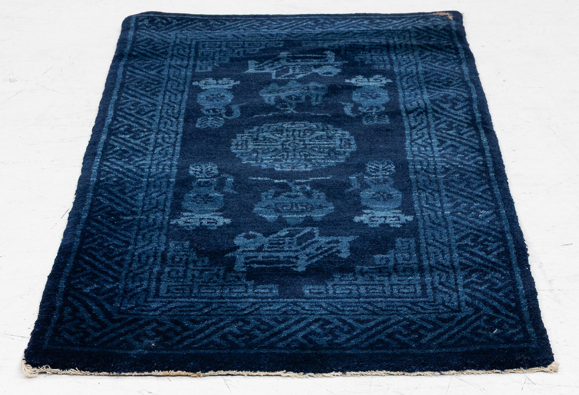 An antique Baotou, rug north China, c. 140 x 70 cm.