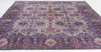 An oriental carpet, approx. 411 x 326 cm.