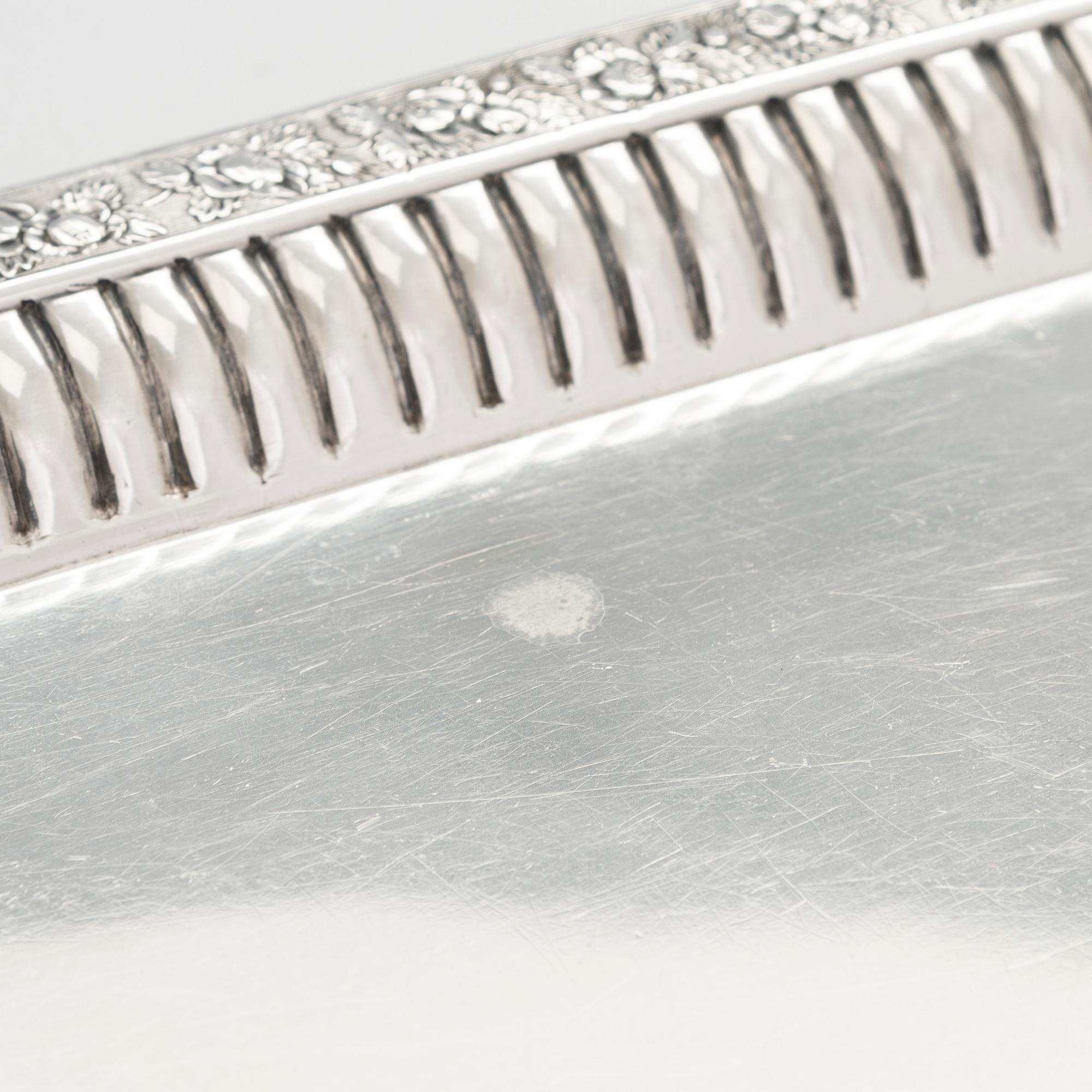 A silver tray, maker's mark of Henrik Tallberg, St. Petersburg 1832.