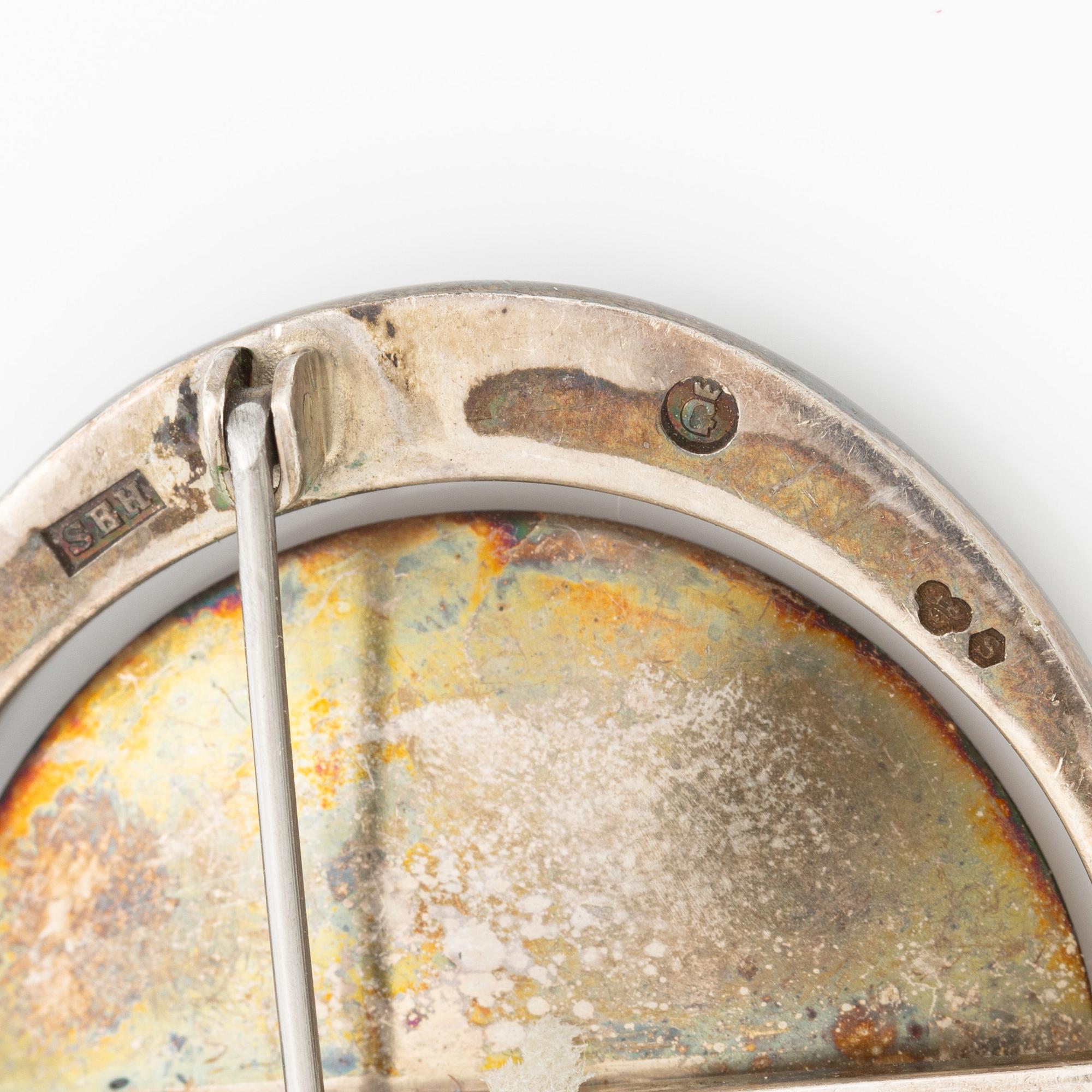 Two brooches, silver with chalcedony and white stones, SE Högberg, Gothenburg 1964 and H Strömdahl, Stockholm.