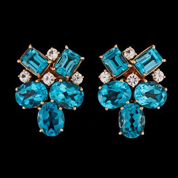 177. A pair of blue topasz and white sapphire earrings.