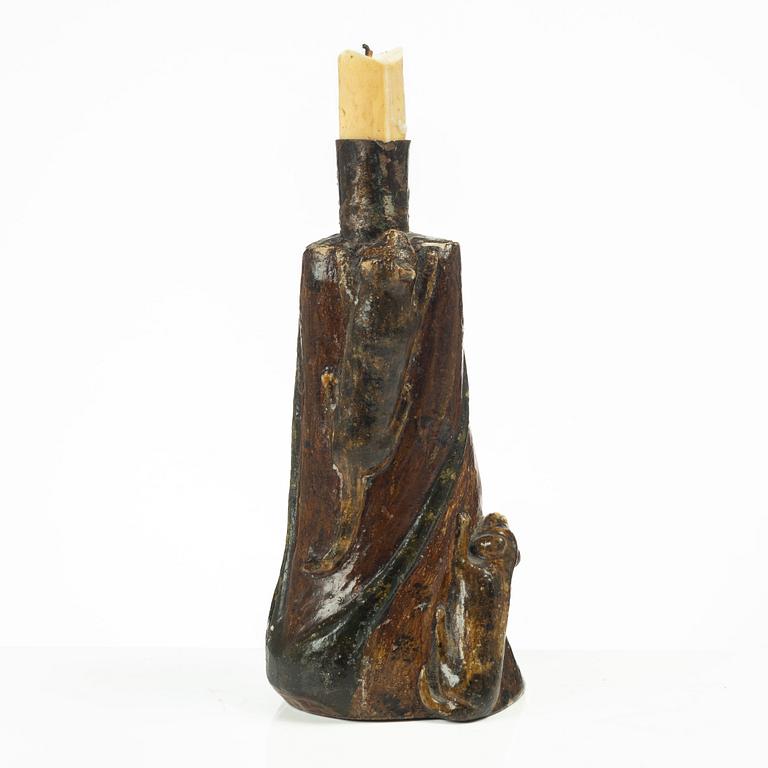 A Swedish folk art carved candlestick, 19th century.
